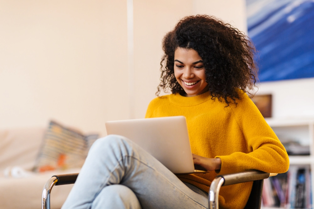 Woman applying for an emergency payday loan on her laptop