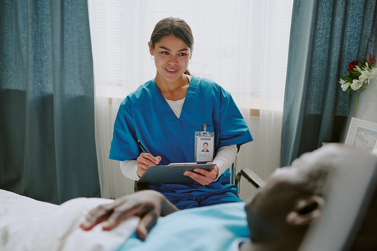 A doctor checking on her patient in the hospital