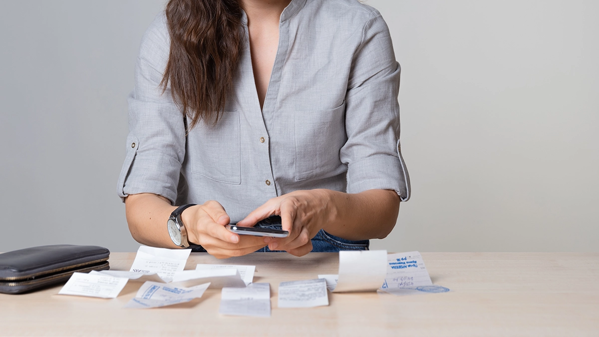 A woman paying her utility bills with a payday loan